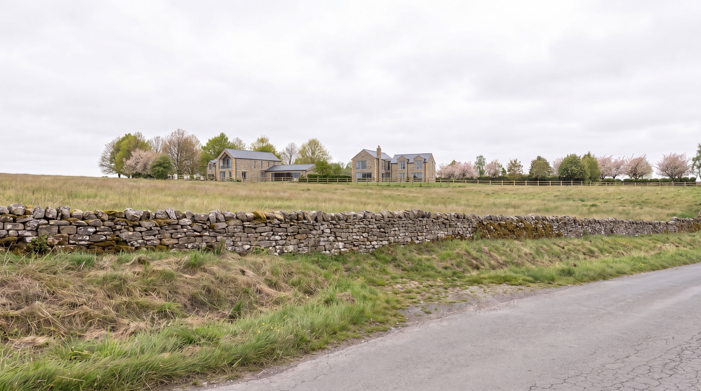 Birkland Farm seen from the lane behind a traditional dry stone wall